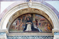 Lunet met Thomas van Aquino op de gevel van de Santa Maria Novella kerk in Florence
