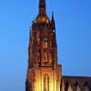 The spire of the Kaiserdom seen from across the river Main