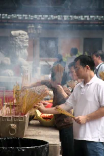 Burning incense sticks at the Wong Tai Sin Temple in Hong Kong