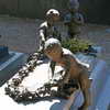 Putti on a grave at the Cimitero Monumentale