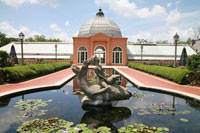 Lily pond and Conservatory of the Two Sisters in the Botanical Garden in New Orleans