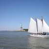Sailboat with Statue of Liberty in background