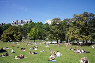 People relaxing in Parc Monceau, Paris