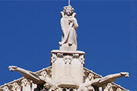 Statue and gargoyles on the Tour St-Jacques in Paris