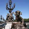 Statues and lampposts decorate the Pont Alexandre III