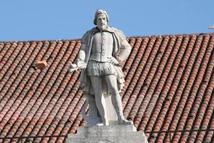 Statue of Gil Vicente on the top of the National Theater at the Rossio in Lisbon